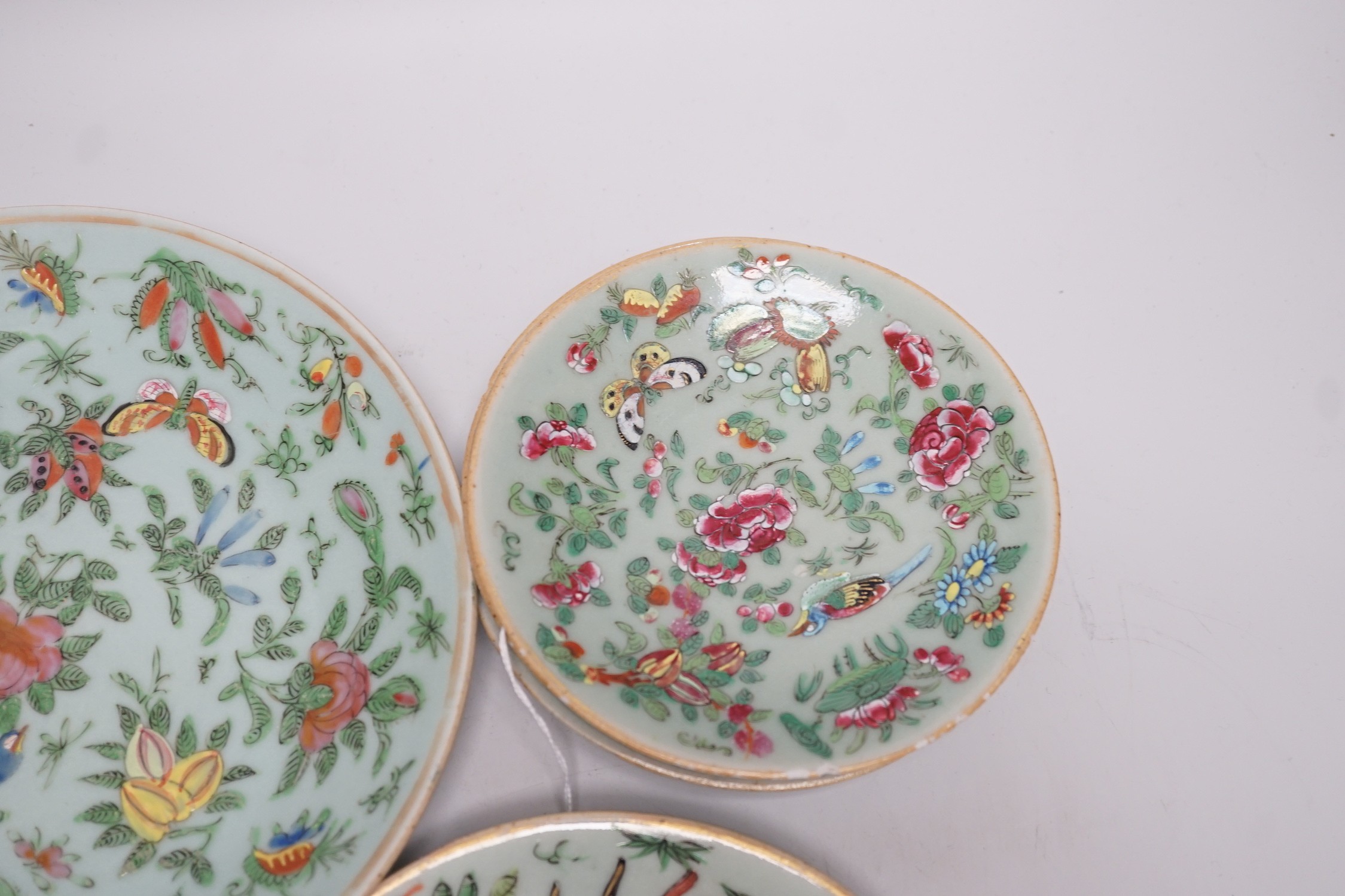 Five 19th century Chinese celadon glazed famille rose dishes, largest 23.5 cm